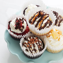 Load image into Gallery viewer, Stack of 6 mini cheesecakes on decorative plate
