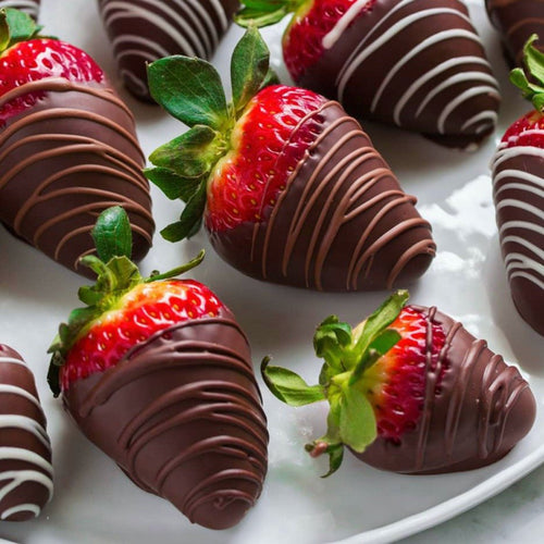 Strawberries covered in chocolate and drizzled in milk, dark or white chocolate