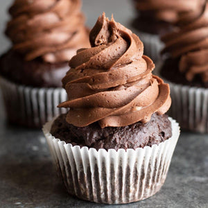 Several chocolate ganache gourmet cupcakes